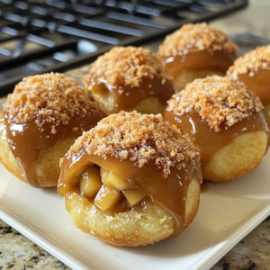 Close-up of Caramel Apple Pie Bombs dusted with cinnamon sugar.