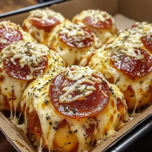 Pepperoni pizza bombs with gooey cheese and dipping sauce