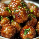 Honey Garlic Meatballs served on a platter with toothpicks and dipping sauce
