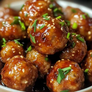 Honey Garlic Meatballs served on a platter with toothpicks and dipping sauce