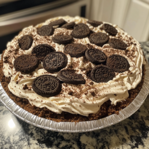 Close-up of Oreo Dirt Pie with cookie crumbs and creamy layers.